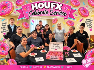 The HOUFX team at a donut-themed 2026 Celebrate Service event with a sign reading "Thank you for making every day sweeter"